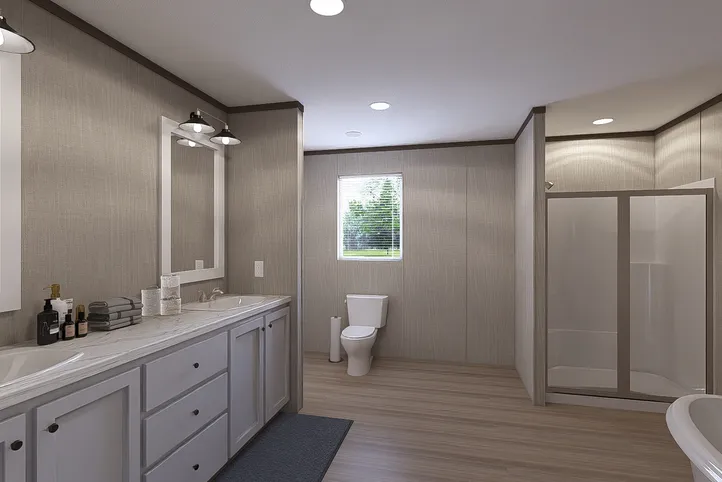 The THE RESERVE 60 Primary Bathroom. This Manufactured Mobile Home features 3 bedrooms and 2 baths.