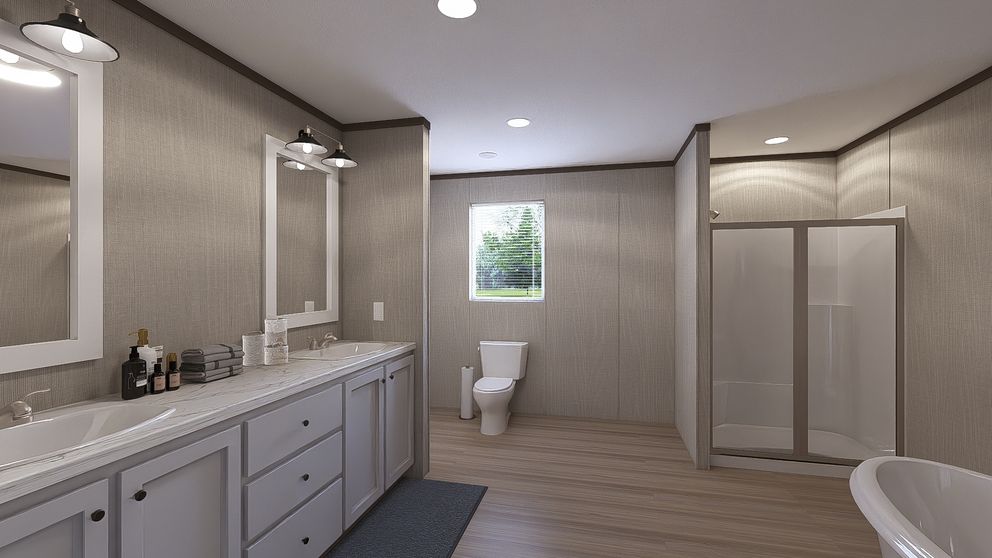 The THE RESERVE 60 Primary Bathroom. This Manufactured Mobile Home features 3 bedrooms and 2 baths.