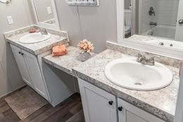 The TRADITION 72 Guest Bathroom. This Manufactured Mobile Home features 4 bedrooms and 2 baths.