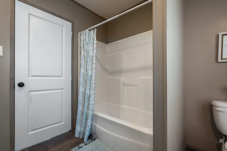 The FARMHOUSE BREEZE 72 Guest Bathroom. This Manufactured Mobile Home features 4 bedrooms and 2 baths.