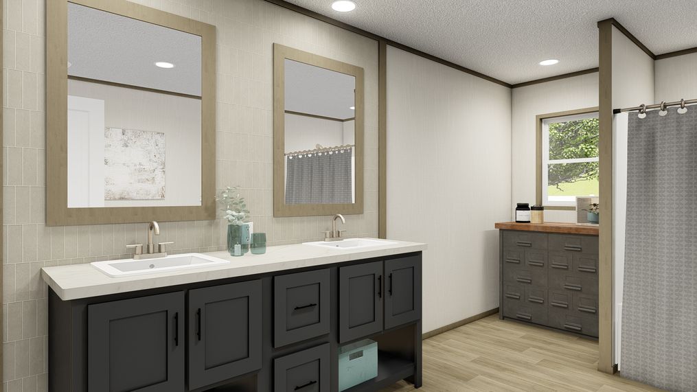 The EVEREST Primary Bathroom. This Manufactured Mobile Home features 4 bedrooms and 2 baths.