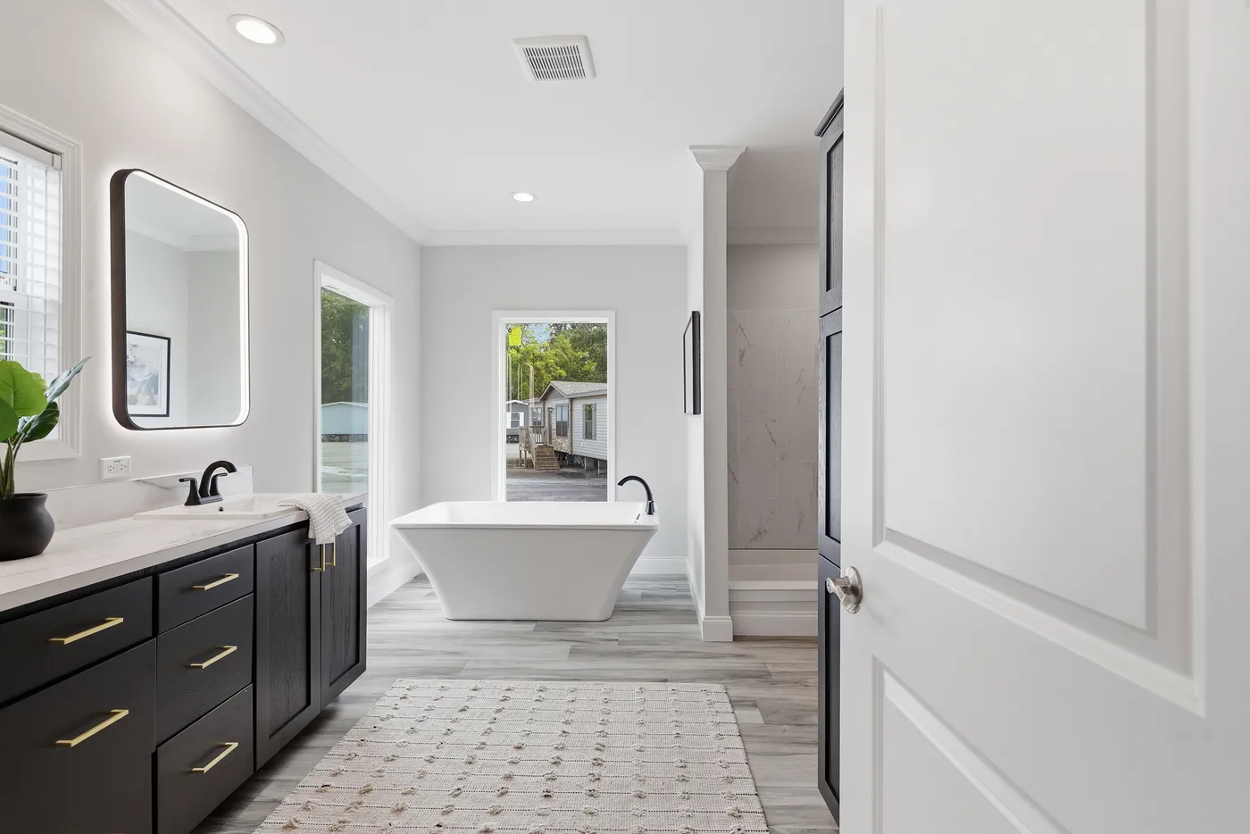 The THE SUMMIT Primary Bathroom. This Manufactured Mobile Home features 3 bedrooms and 2 baths.