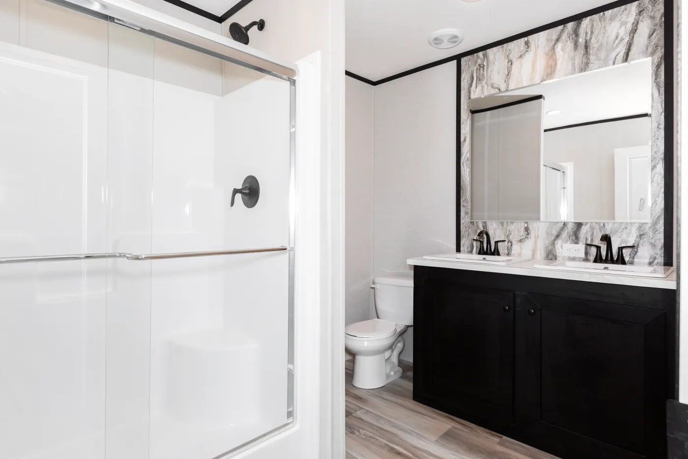 The THE FUJI Primary Bathroom. This Manufactured Mobile Home features 3 bedrooms and 2 baths.