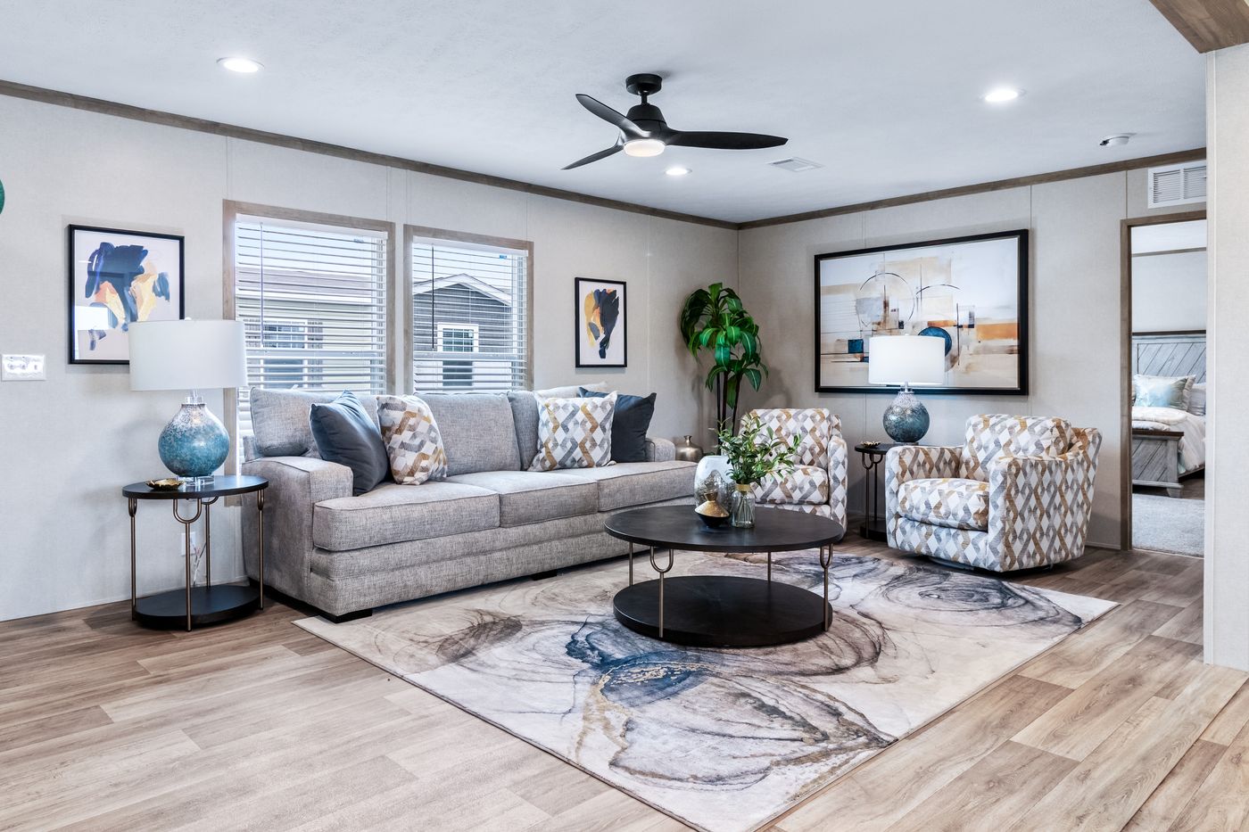 The THE CHOICE Living Room. This Manufactured Mobile Home features 4 bedrooms and 2 baths.