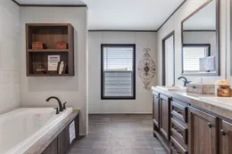 The HERCULES Primary Bathroom. This Manufactured Mobile Home features 4 bedrooms and 2 baths.