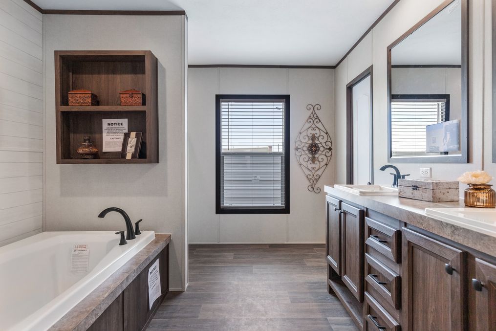 The HERCULES Primary Bathroom. This Manufactured Mobile Home features 4 bedrooms and 2 baths.