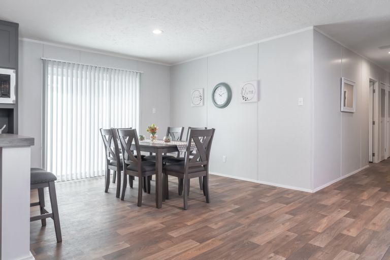 The TRADITION 3268B Dining Room. This Manufactured Mobile Home features 5 bedrooms and 3 baths.