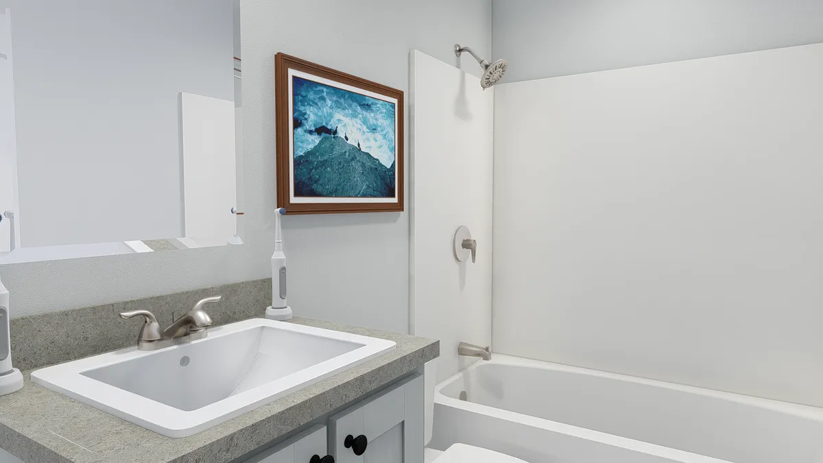 The HERE COMES THE SUN Guest Bathroom. This Manufactured Mobile Home features 3 bedrooms and 2 baths.