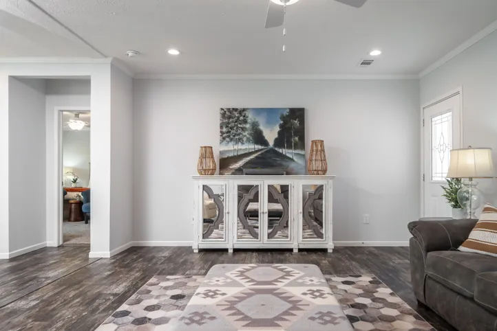 The THE HEWITT Living Room. This Manufactured Mobile Home features 4 bedrooms and 3 baths.