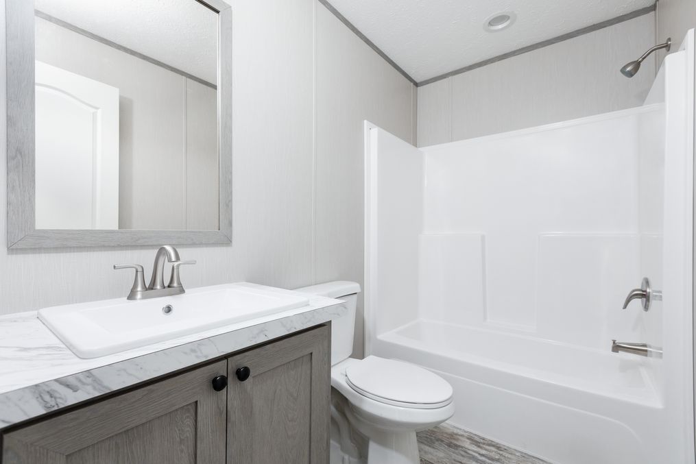 The BOLT Guest Bathroom. This Manufactured Mobile Home features 4 bedrooms and 2 baths.