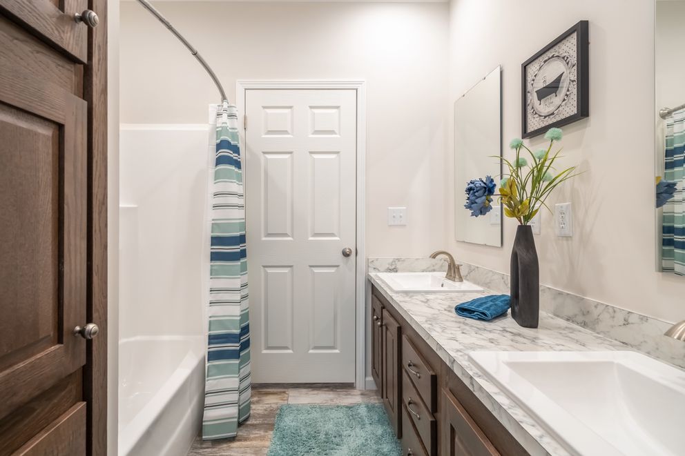 The 1444 CAROLINA Guest Bathroom. This Manufactured Mobile Home features 4 bedrooms and 2 baths.