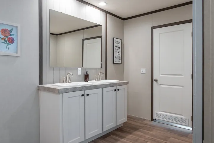 The EMPOWER Primary Bathroom. This Manufactured Mobile Home features 4 bedrooms and 2 baths.