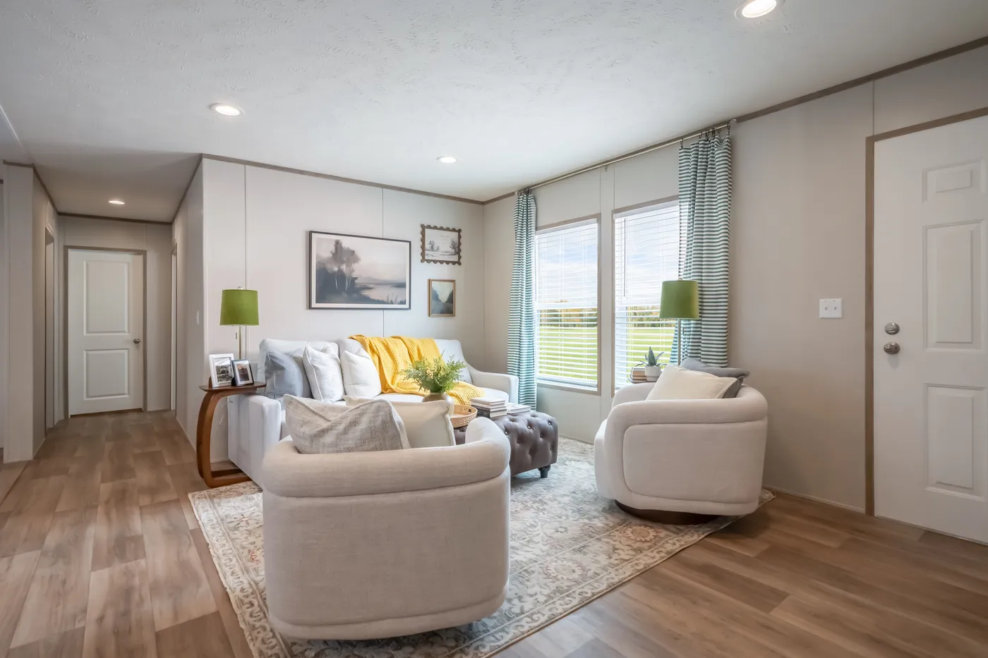 The VISTA Living Room. This Manufactured Mobile Home features 3 bedrooms and 2 baths.