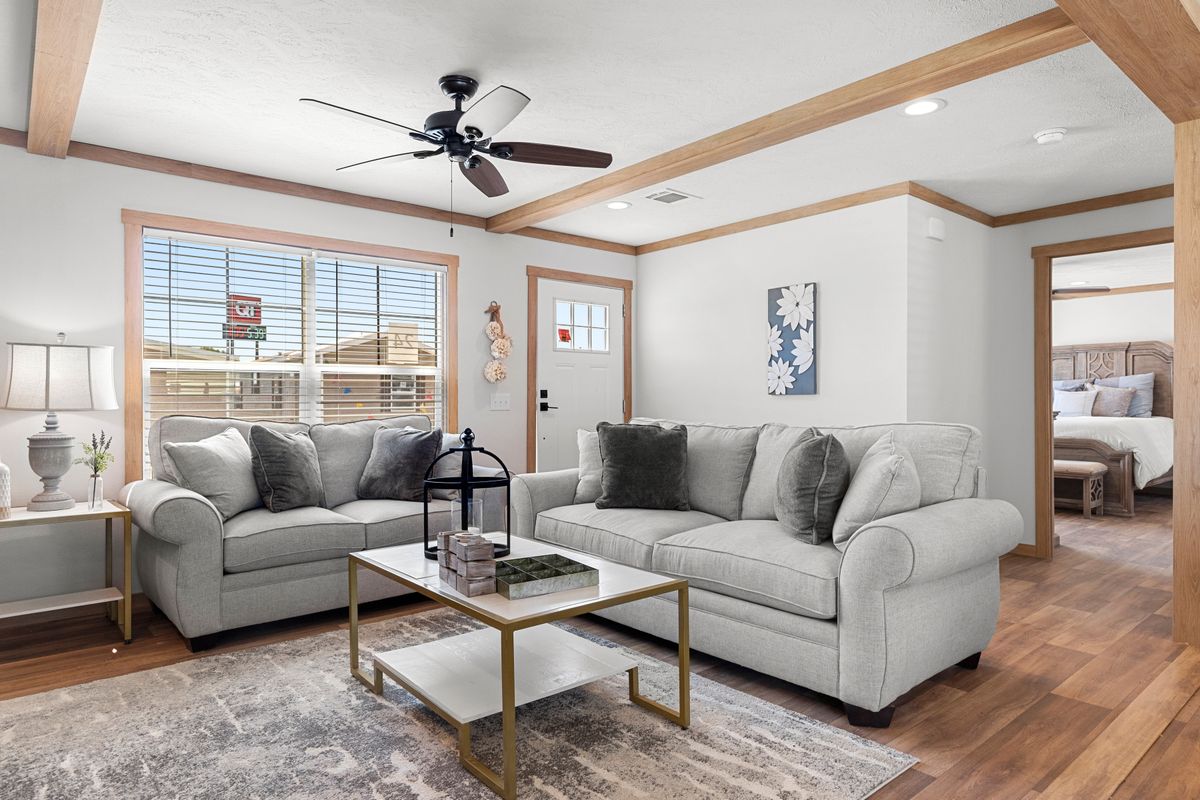 The LORALEI Living Room. This Manufactured Mobile Home features 3 bedrooms and 2 baths.
