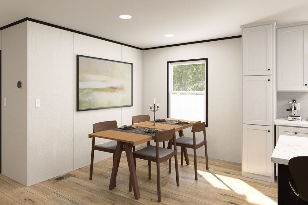 The ULTRA FLEX Dining Area. This Manufactured Mobile Home features 3 bedrooms and 2 baths.