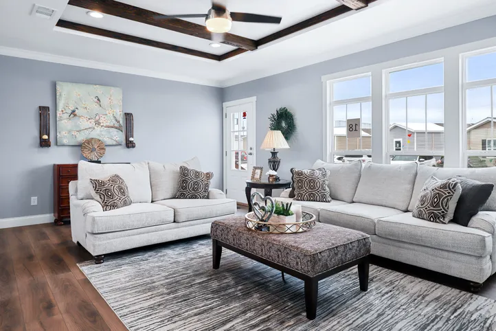 The THE ATLAS Living Room. This Manufactured Mobile Home features 4 bedrooms and 3 baths.