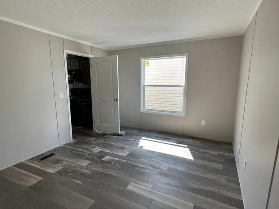 The SAPPHIRE XL 8016-644 Guest Bedroom. This Manufactured Mobile Home features 3 bedrooms and 2 baths.