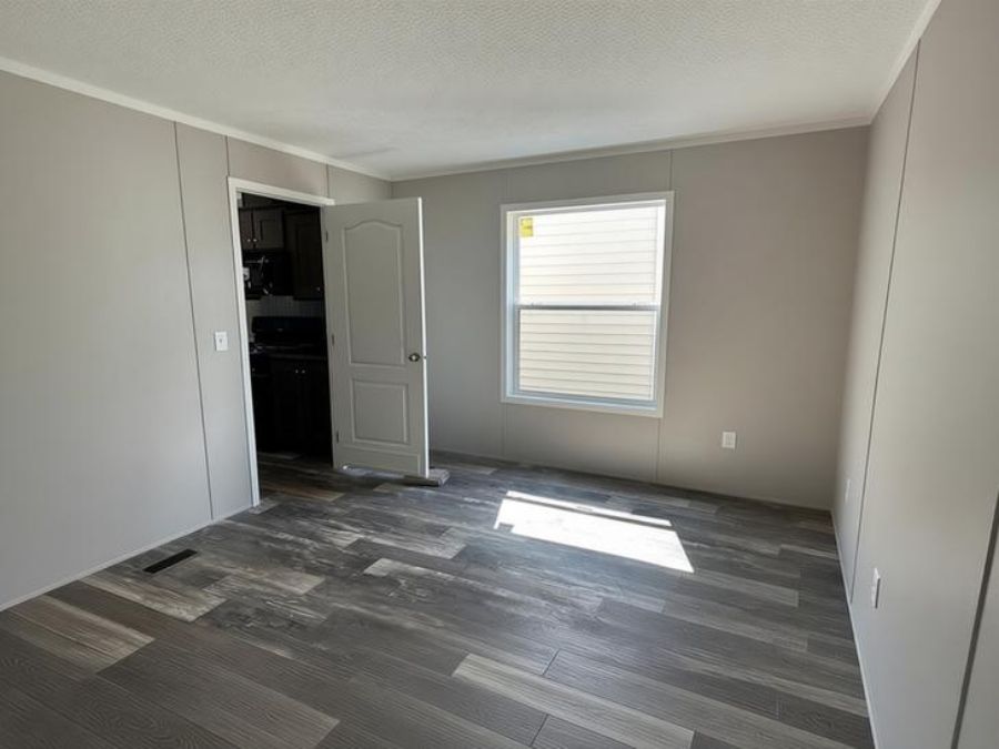 The SAPPHIRE XL 8016-644 Guest Bedroom. This Manufactured Mobile Home features 3 bedrooms and 2 baths.