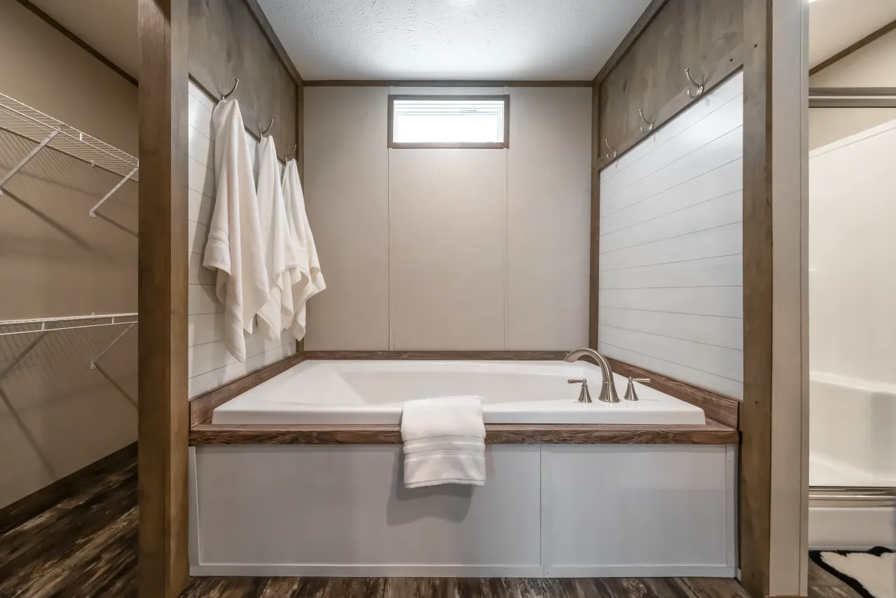 The ANNIVERSARY ENTERTAINER Exterior. This Manufactured Mobile Home features 3 bedrooms and 2 baths.