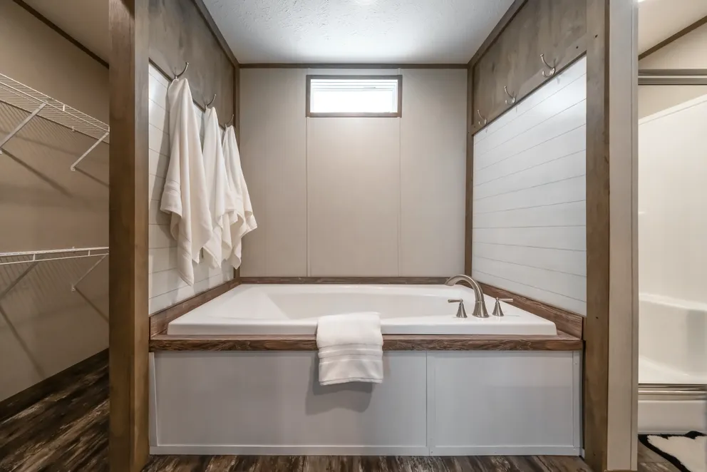The ANNIVERSARY ENTERTAINER Exterior. This Manufactured Mobile Home features 3 bedrooms and 2 baths.
