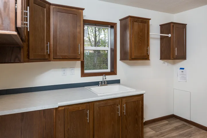 The LEGEND 86 Utility Room. This Manufactured Mobile Home features 3 bedrooms and 2 baths.