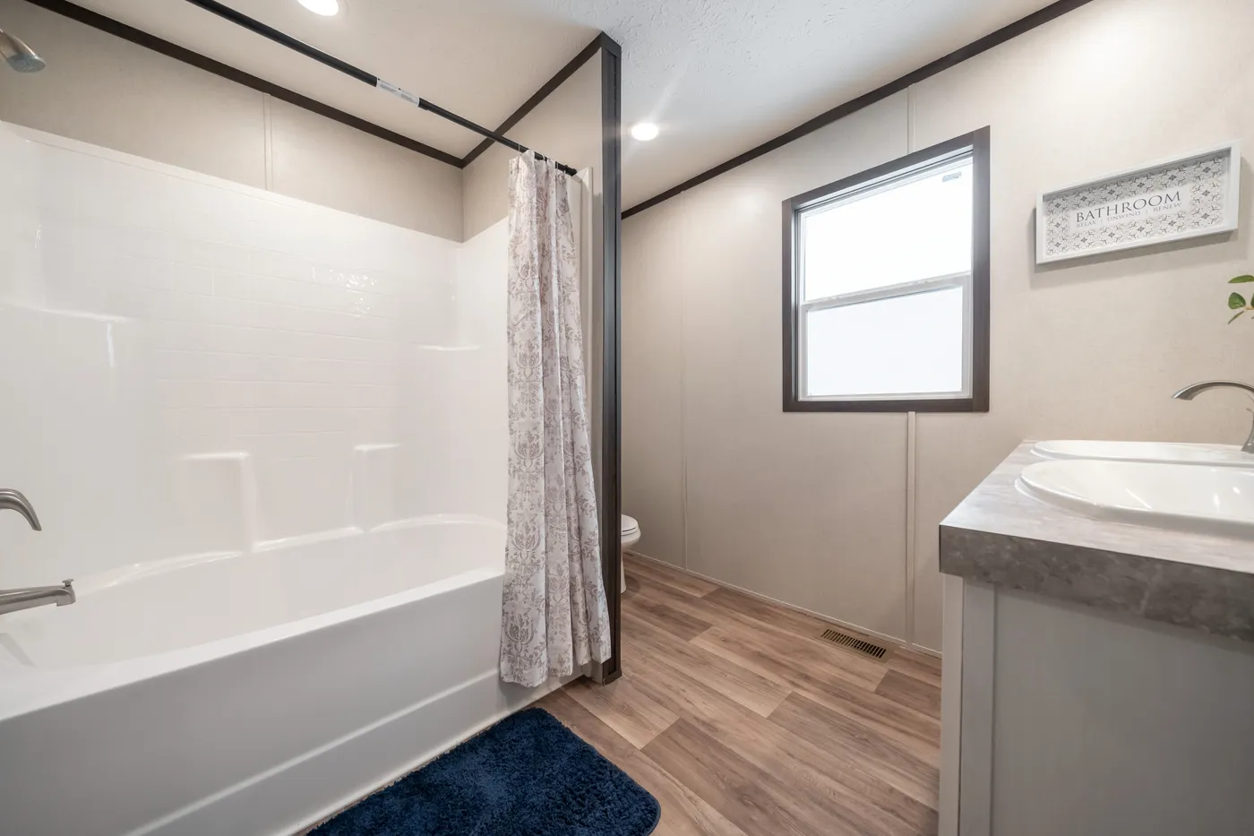 The ESSENCE Guest Bathroom. This Manufactured Mobile Home features 3 bedrooms and 2 baths.