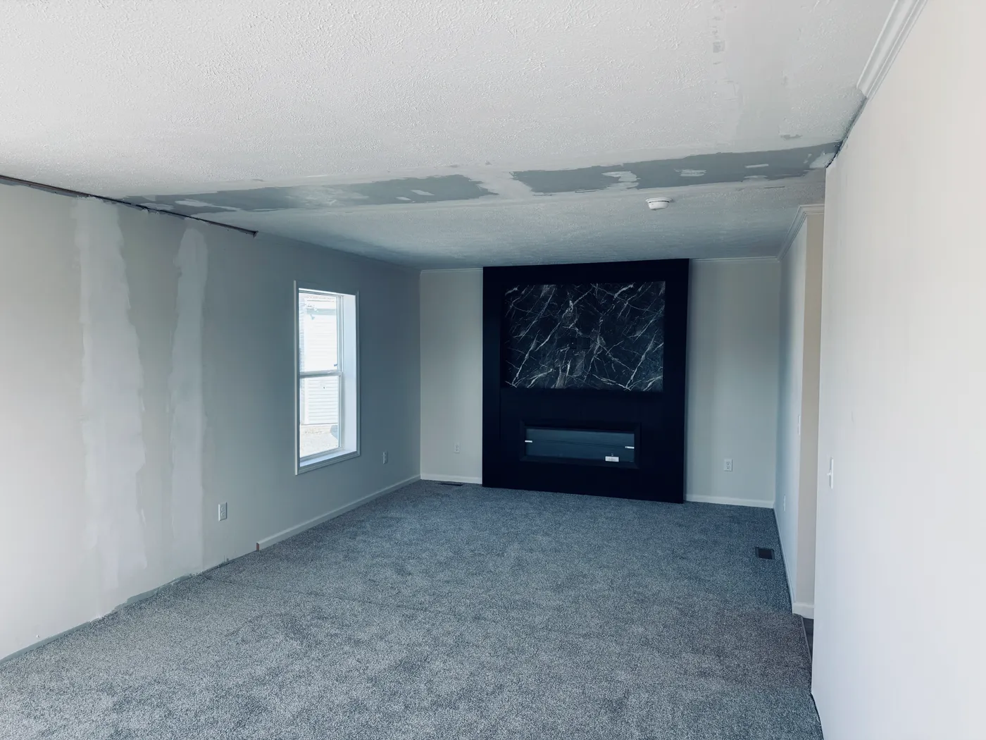 The TOURMALINE 7628-649 Living Room. This Manufactured Mobile Home features 4 bedrooms and 2 baths.