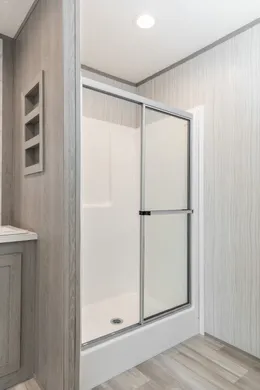The BLAZER 66 F Primary Bathroom. This Manufactured Mobile Home features 3 bedrooms and 2 baths.