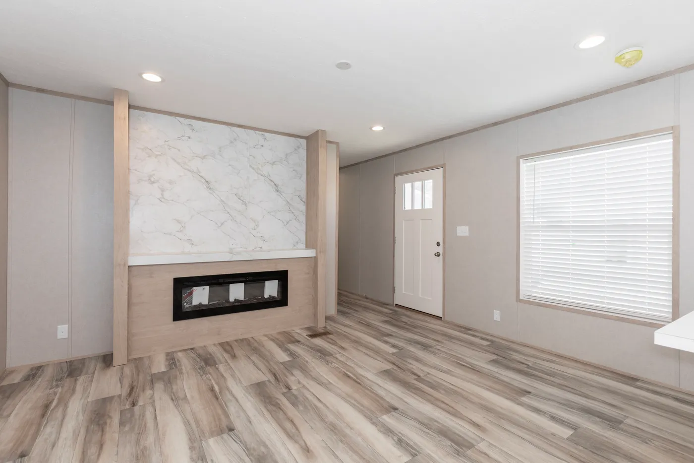 The THE THUNDERHEAD Living Room. This Manufactured Mobile Home features 3 bedrooms and 2 baths.