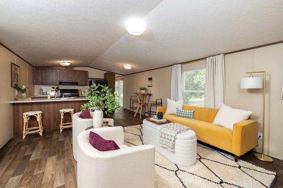 The CELEBRATION Living Room. This Manufactured Mobile Home features 3 bedrooms and 2 baths.
