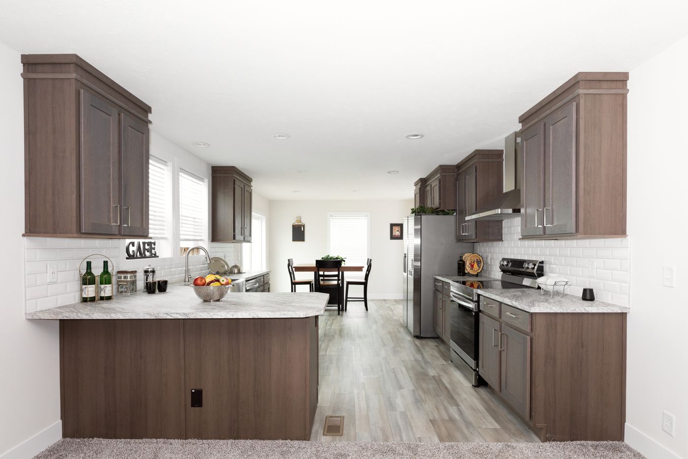 The HILL ST/5628-MS020-1 SECT Kitchen. This Manufactured Mobile Home features 3 bedrooms and 2 baths.