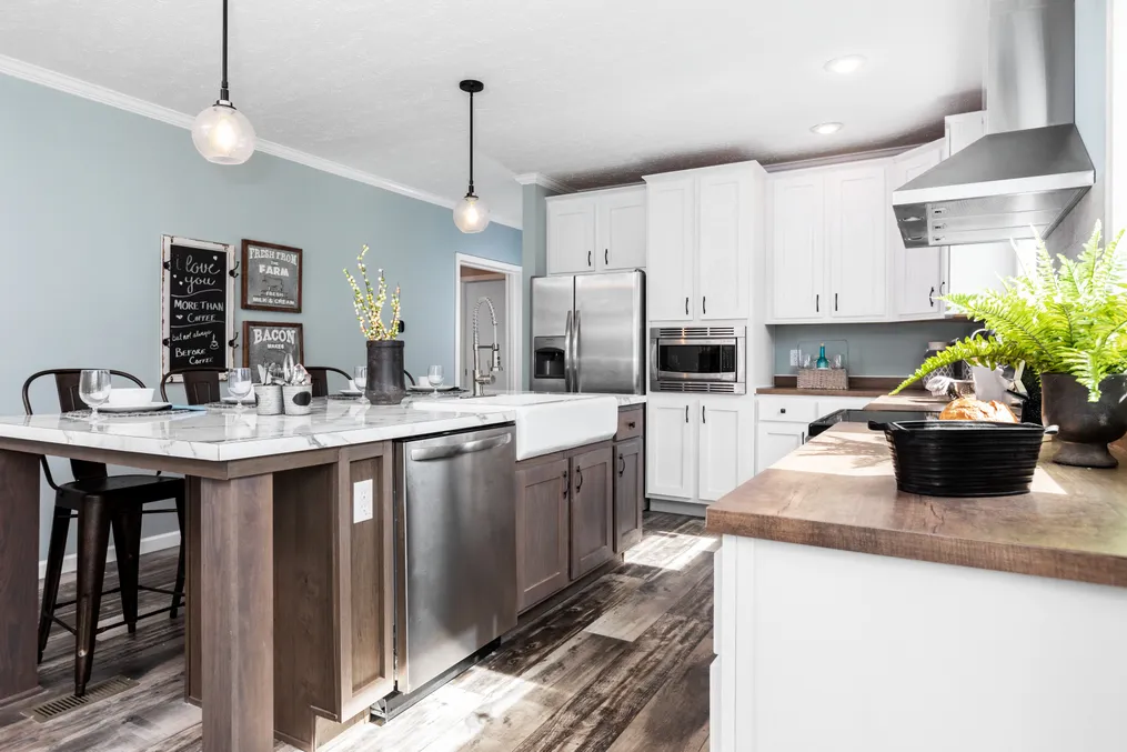 The COUNTRY AIRE Kitchen. This Manufactured Mobile Home features 3 bedrooms and 3 baths.