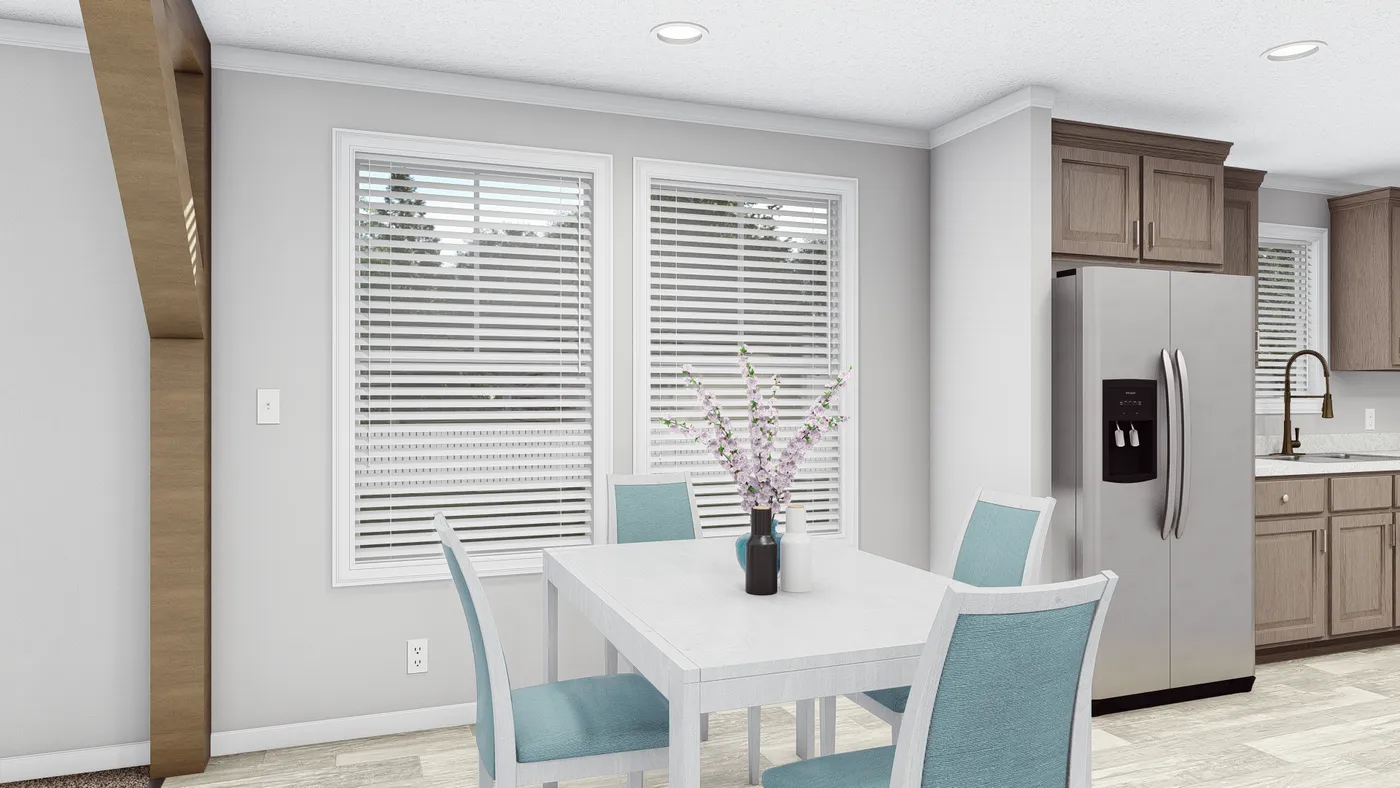 The THE SOUTHERN CHARM Dining Area. This Manufactured Mobile Home features 3 bedrooms and 2 baths.
