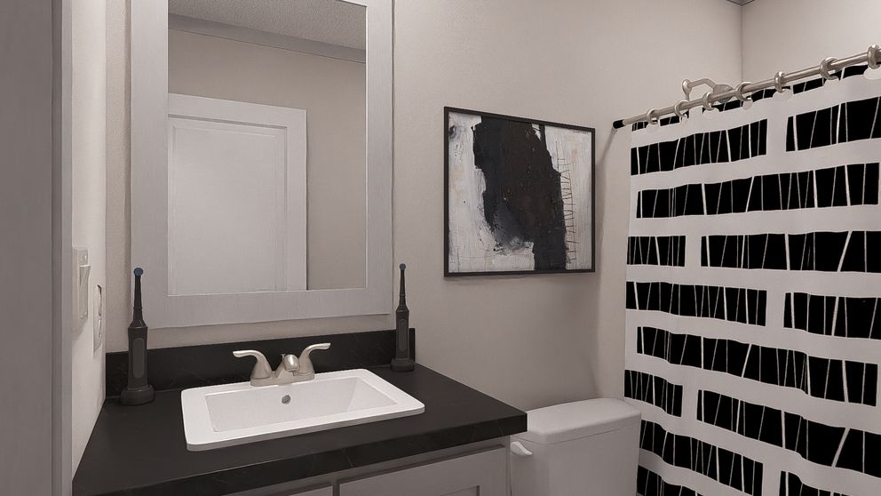 The JOHNNY B GOODE Guest Bathroom. This Manufactured Mobile Home features 3 bedrooms and 2 baths.