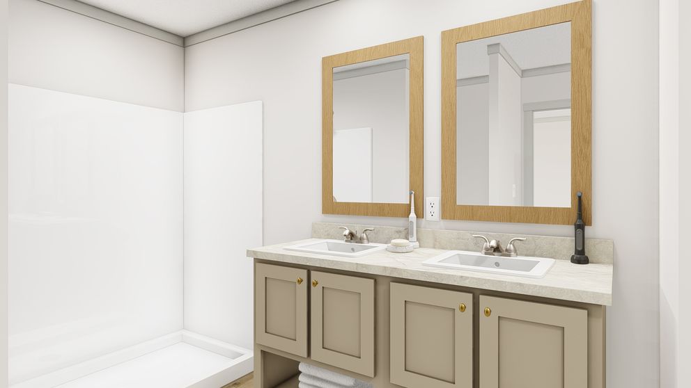 The SWEET CAROLINE Primary Bathroom. This Manufactured Mobile Home features 3 bedrooms and 2 baths.