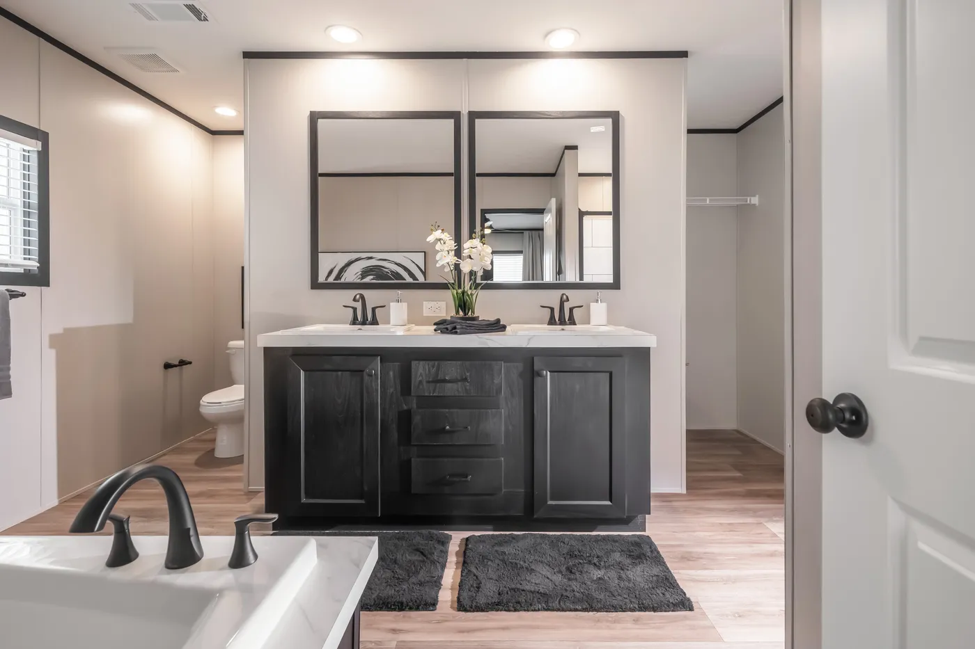 The THE ANNIVERSARY 2.1 Primary Bathroom. This Manufactured Mobile Home features 3 bedrooms and 2 baths.