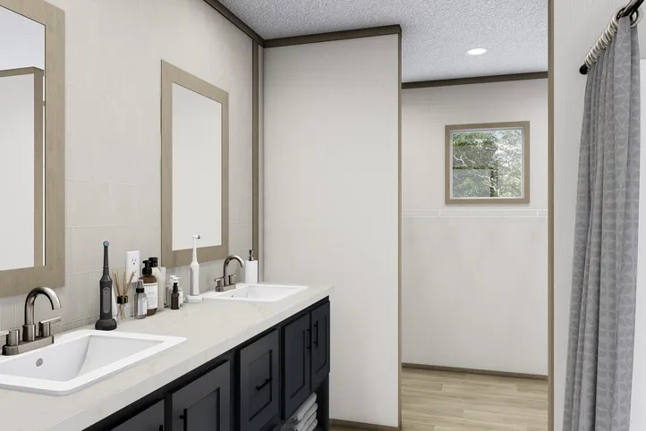 The BOONE Primary Bathroom. This Manufactured Mobile Home features 4 bedrooms and 2 baths.