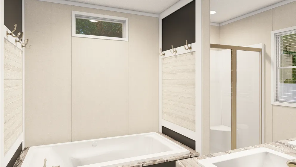 The GRAND LIVING 76B Primary Bathroom. This Manufactured Mobile Home features 3 bedrooms and 2 baths.