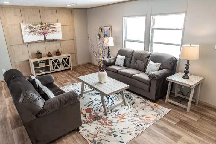 The RIO Living Room. This Manufactured Mobile Home features 3 bedrooms and 2 baths.