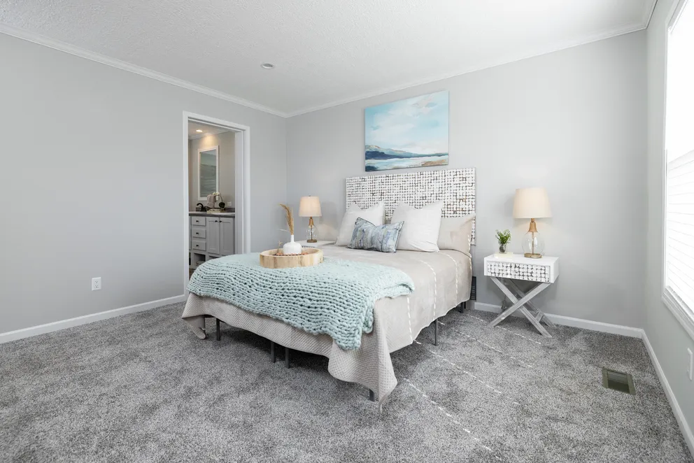 The THE JEFFERSON Primary Bedroom. This Manufactured Mobile Home features 3 bedrooms and 2 baths.