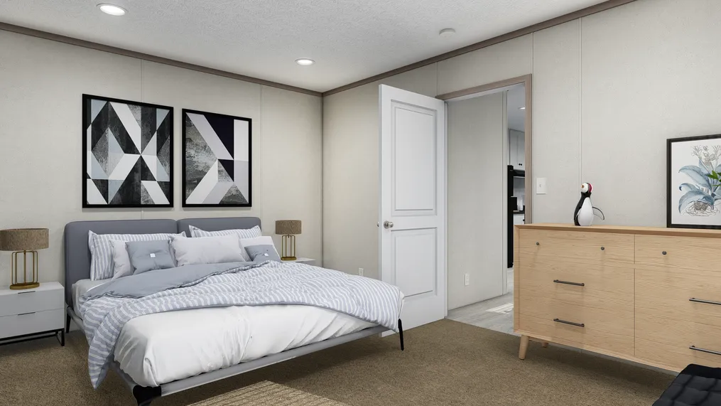 The 7616-4700 THE PULSE Primary Bedroom. This Manufactured Mobile Home features 3 bedrooms and 2 baths.