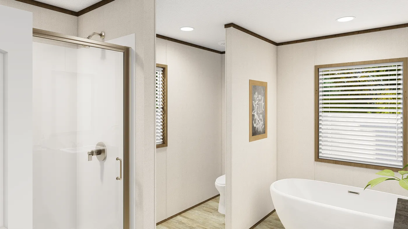 The GRAND LIVING 64 Primary Bathroom. This Manufactured Mobile Home features 3 bedrooms and 2 baths.
