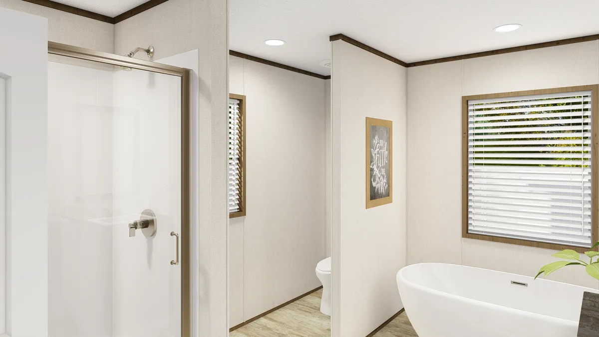 The GRAND LIVING 64 Primary Bathroom. This Manufactured Mobile Home features 3 bedrooms and 2 baths.
