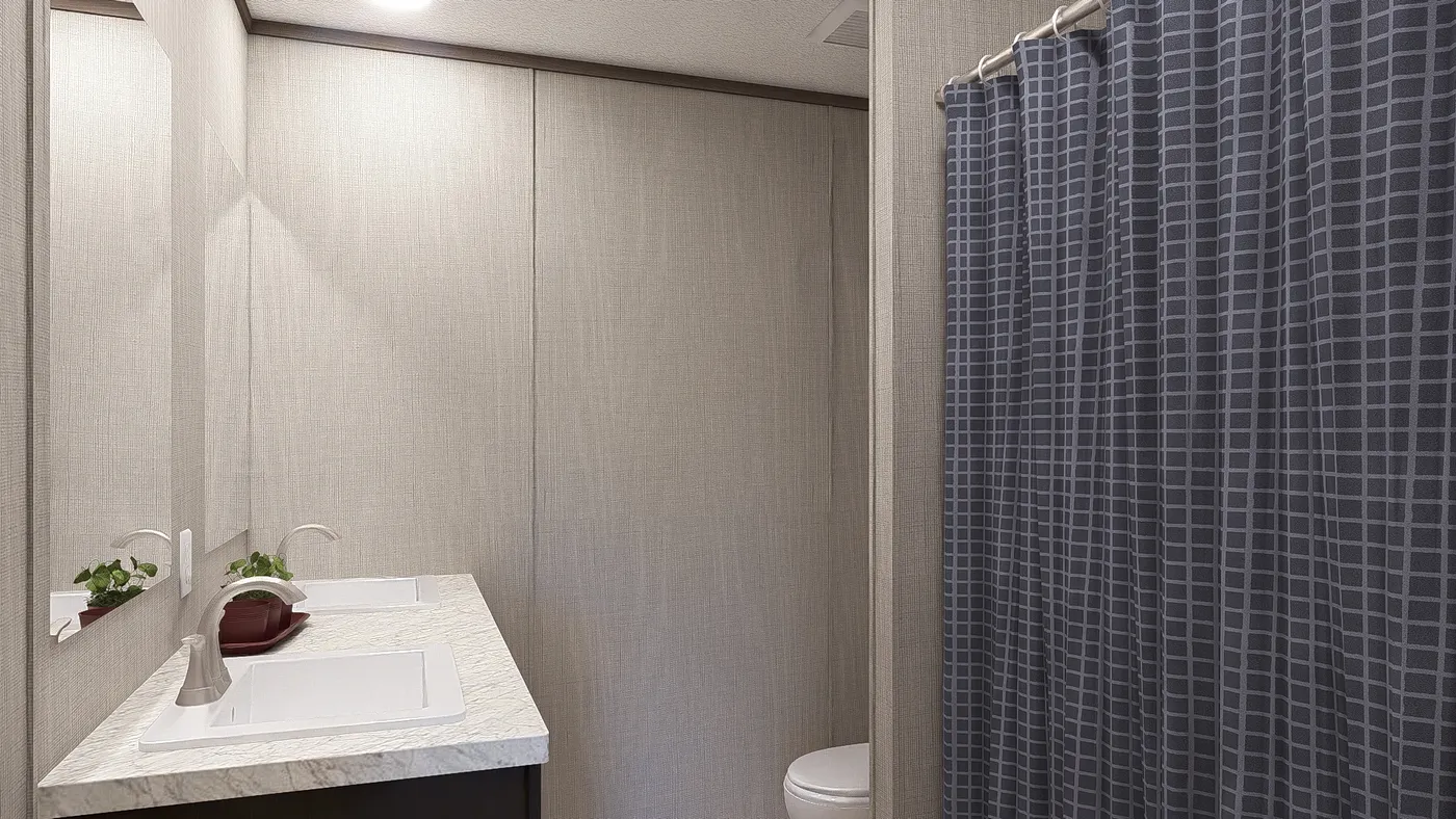 The ULTRA BREEZE 28X76 Guest Bathroom. This Manufactured Mobile Home features 4 bedrooms and 2 baths.