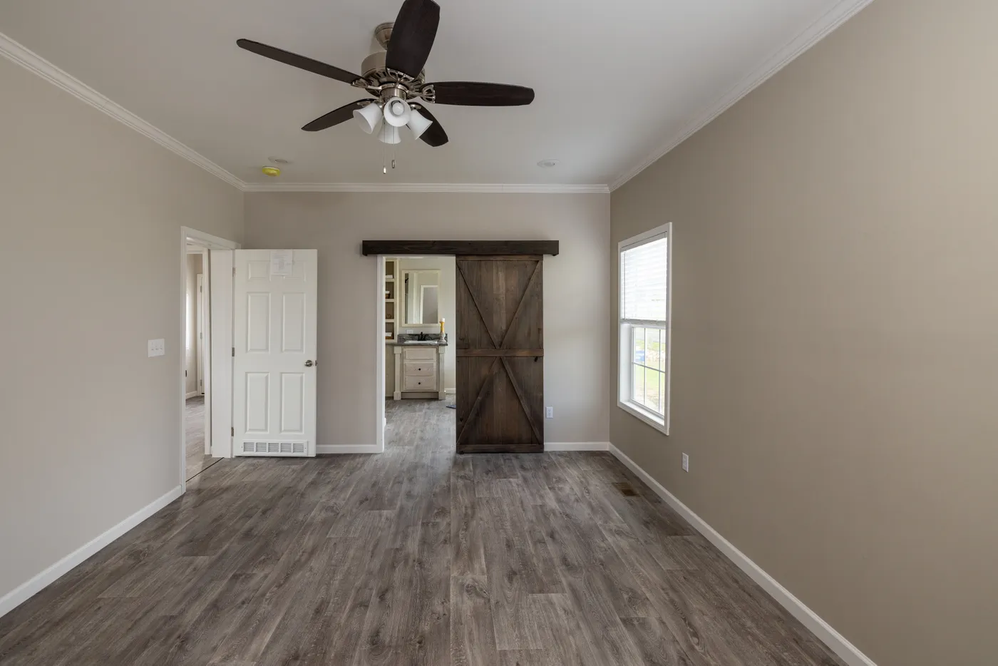 The THE ROGUE Primary Bedroom. This Manufactured Mobile Home features 3 bedrooms and 2 baths.