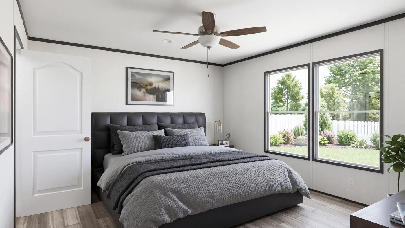 The THE MOUNTAINEER 56 Primary Bedroom. This Manufactured Mobile Home features 3 bedrooms and 2 baths.