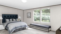 The PRIDE Primary Bedroom. This Manufactured Mobile Home features 4 bedrooms and 2 baths.