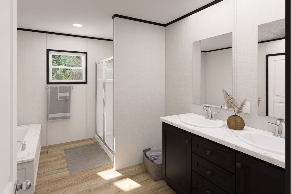 The ULTRA FLEX Primary Bathroom. This Manufactured Mobile Home features 3 bedrooms and 2 baths.