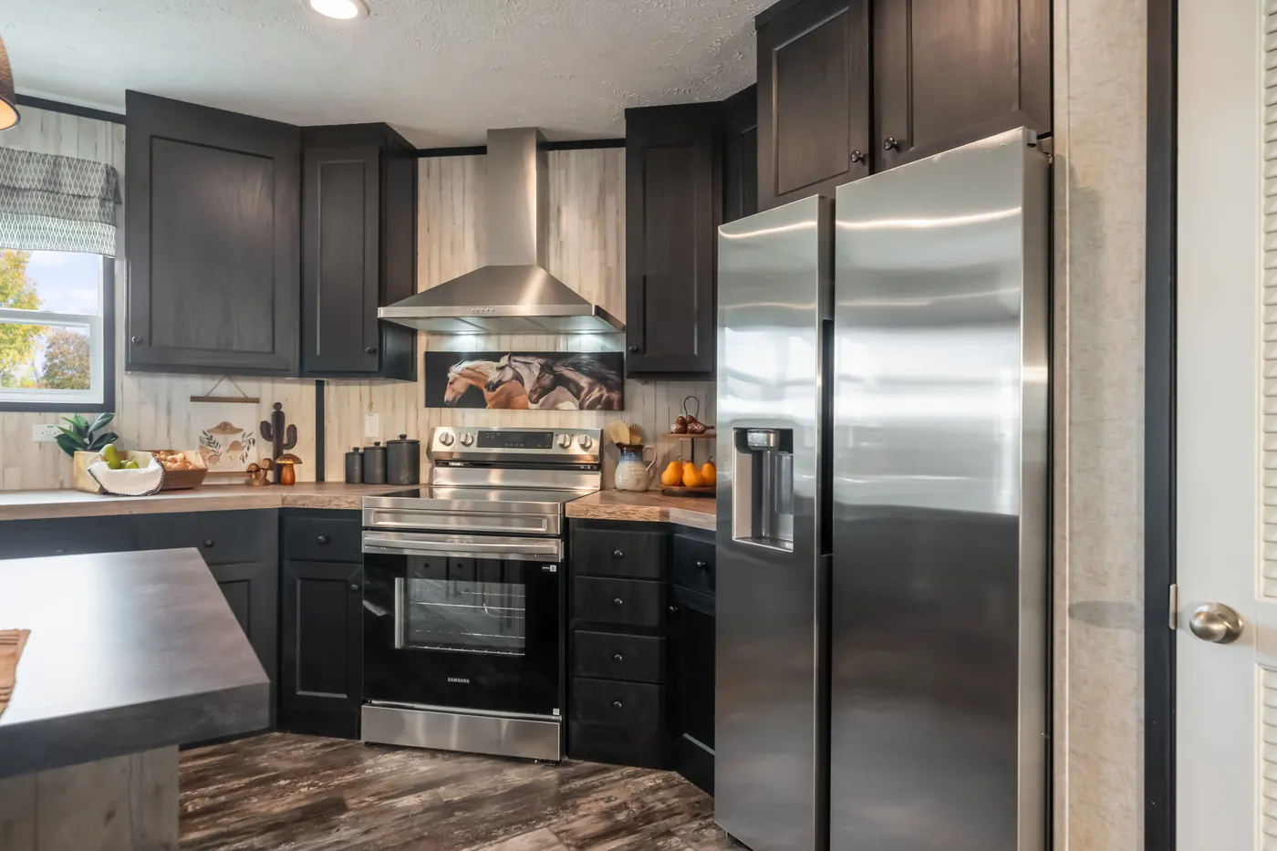 The THE TRIBUTARY Kitchen. This Manufactured Mobile Home features 3 bedrooms and 2 baths.