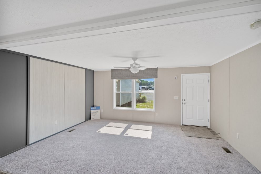 The ZIRCON Living Room. This Manufactured Mobile Home features 3 bedrooms and 2 baths.